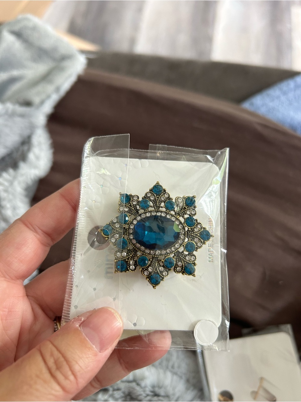4/$50 Blue Crystal Sunburst Brooch